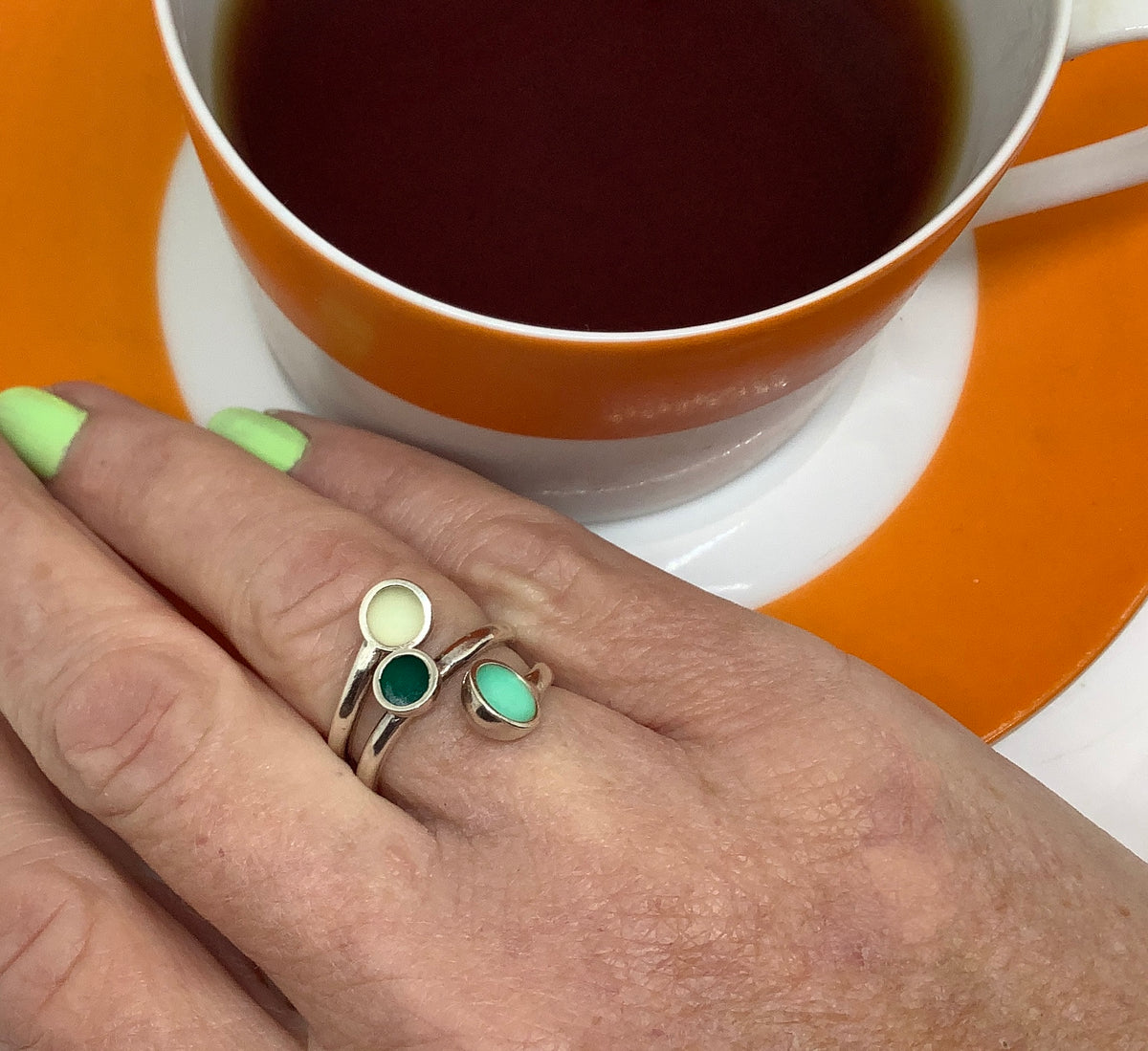 Sterling silver ring with mid teal, dark green and white enamel