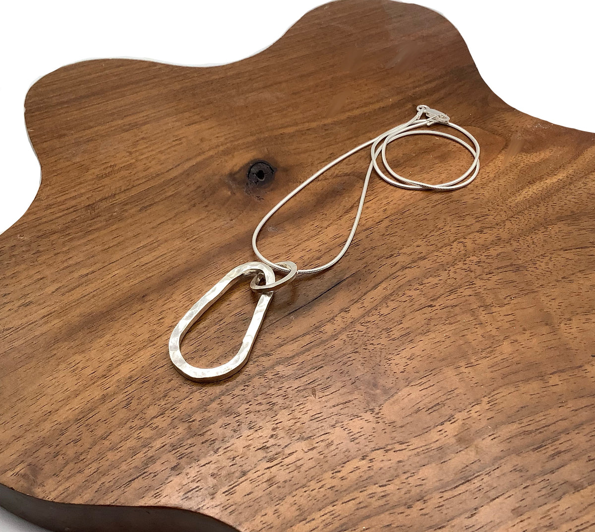 Sterling silver hammered squashed oval pendant