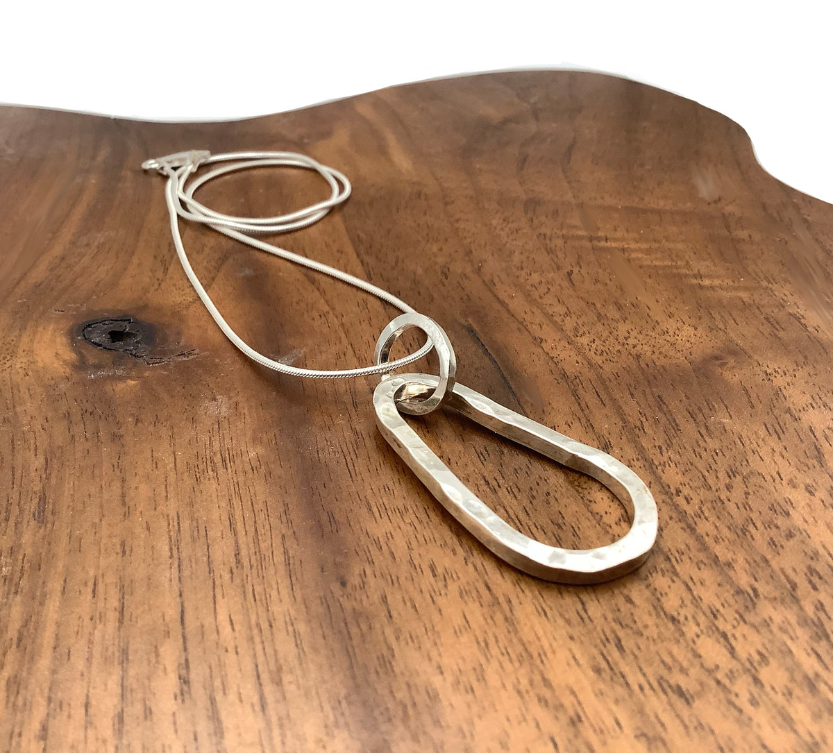 Sterling silver hammered squashed oval pendant
