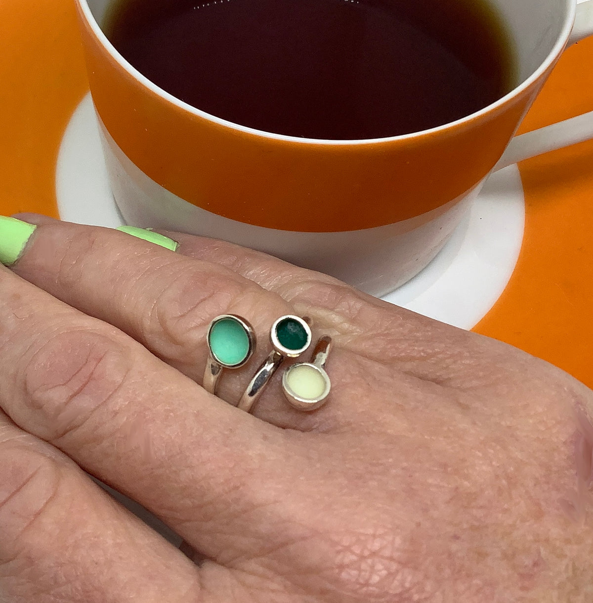 Sterling silver ring with mid teal, dark green and white enamel