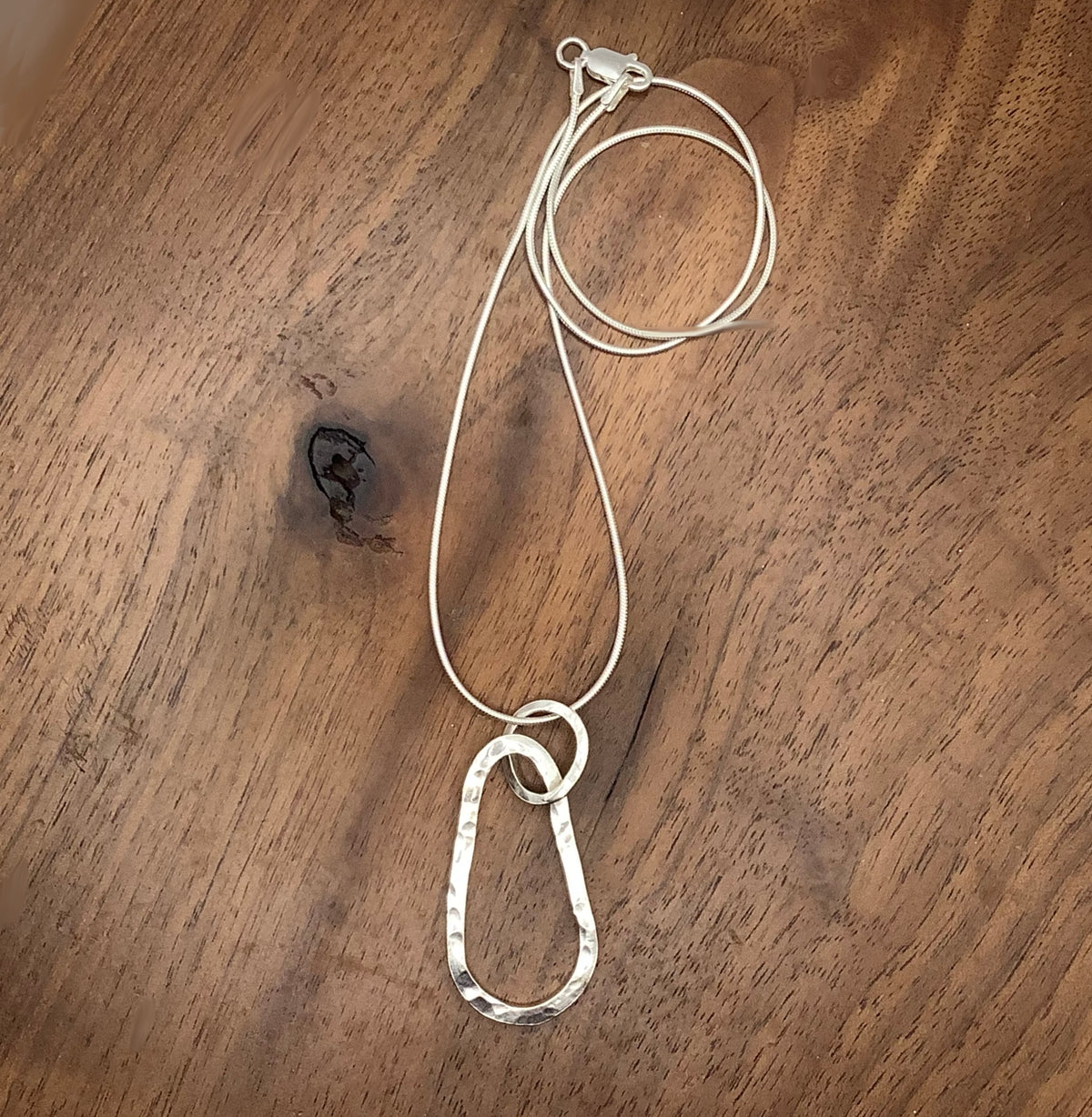 Sterling silver hammered squashed oval pendant