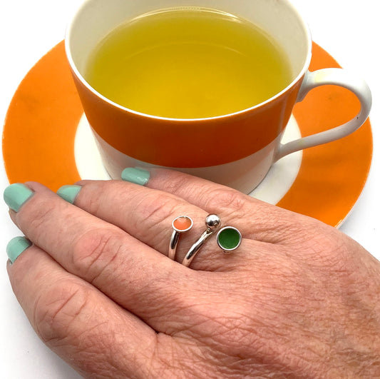 Sterling silver adjustable ring with green and orange enamel