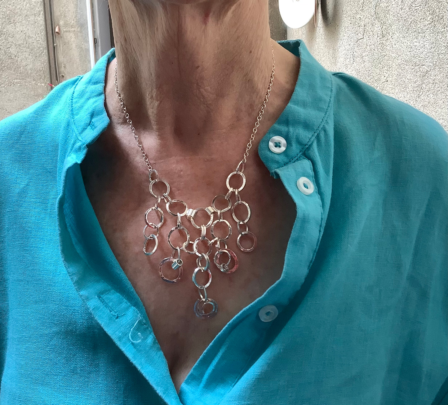 Sterling silver hammered hoops necklace.