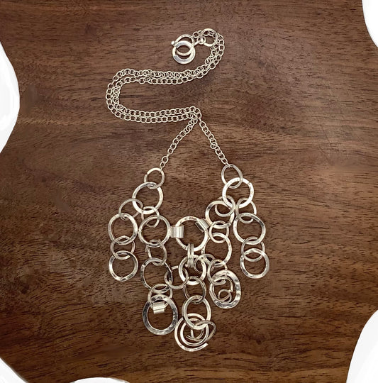 Sterling silver hammered hoops necklace.